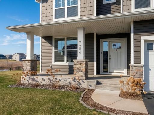 South facing covered front porch to welcome friends and family.