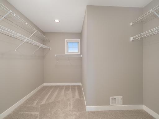 Large and very functional owner's closet space with plenty of room to organize all of your clothes.