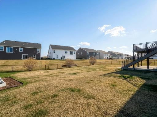 Large fenced in backyard for children to play in or dogs to roam.