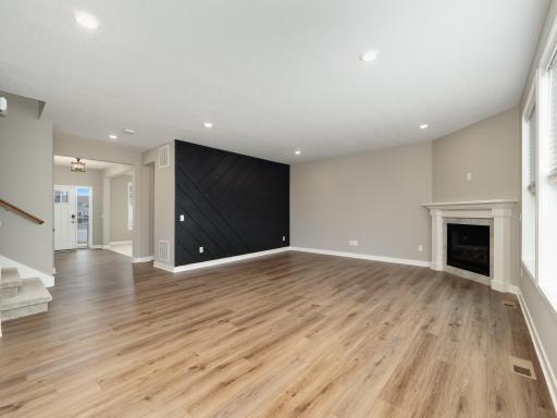View from the dining room towards the front entrance. Beautiful easy to maintain LVT flooring.