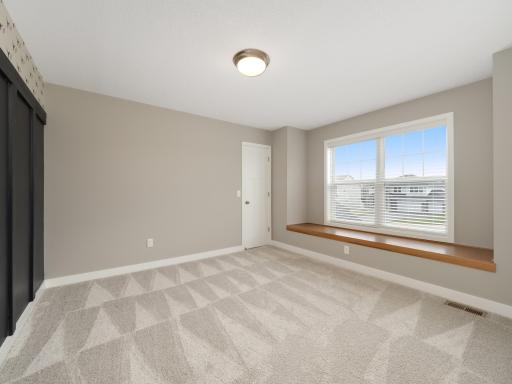 Another upper floor bedroom with south facing exposure.