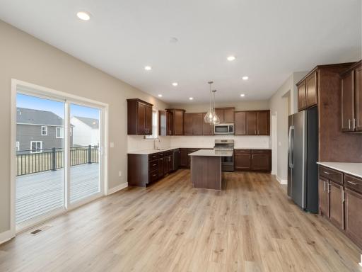 The dining room is centrally located between the living room, kitchen and rear deck. Perfect for smaller family meals or extend outwards for those larger gatherings.