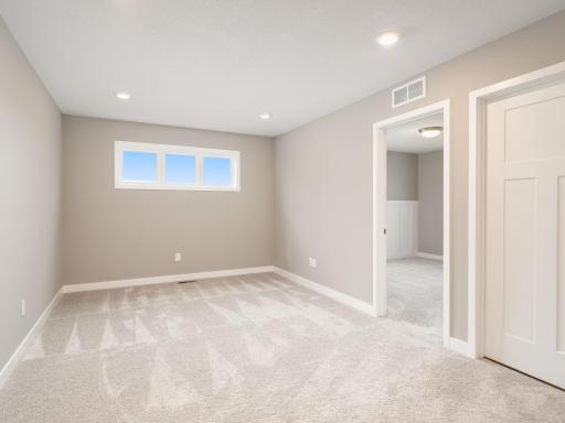 As you come up the stairs from the lower level, this is the second floor lofted style family room. Great place for a large screen TV and comfortable couch. Curl up and read a book or perhaps watch your favorites shows.
