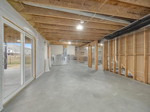 Looking back the other way in the lower level you can see how much open space is available for a future recreation or game room. There is bathroom rough in the back right corner.