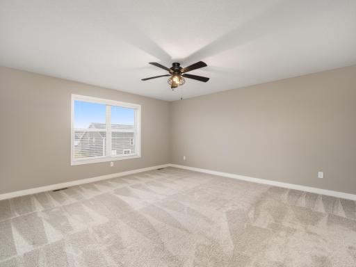 Fantastic owners suite can easily accommodate a king size bed and additional furnishings. Located at the rear of the house with a nice view of the backyard.