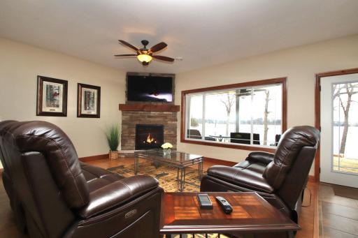 Living room with wonderful lake views. The gas fireplace was new in 2025.