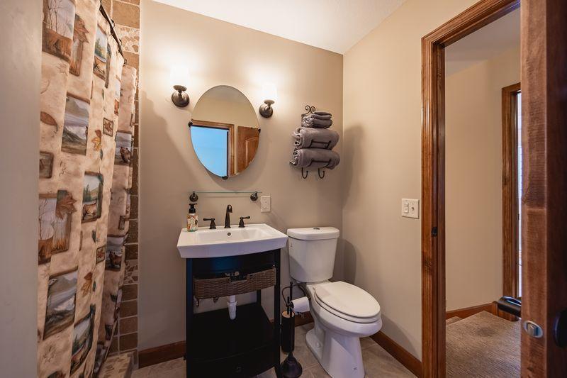 Primary bedroom suite bathroom with beautiful tiled walk in shower.