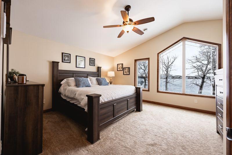 Upper level primary bedroom suite with walk-in-closet and 3/4 bath.