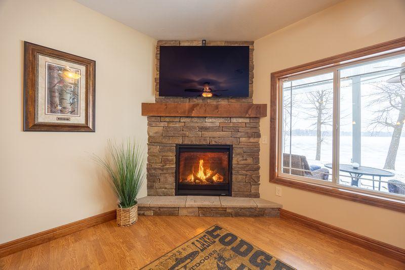 New fireplace (2025) with brick surround.