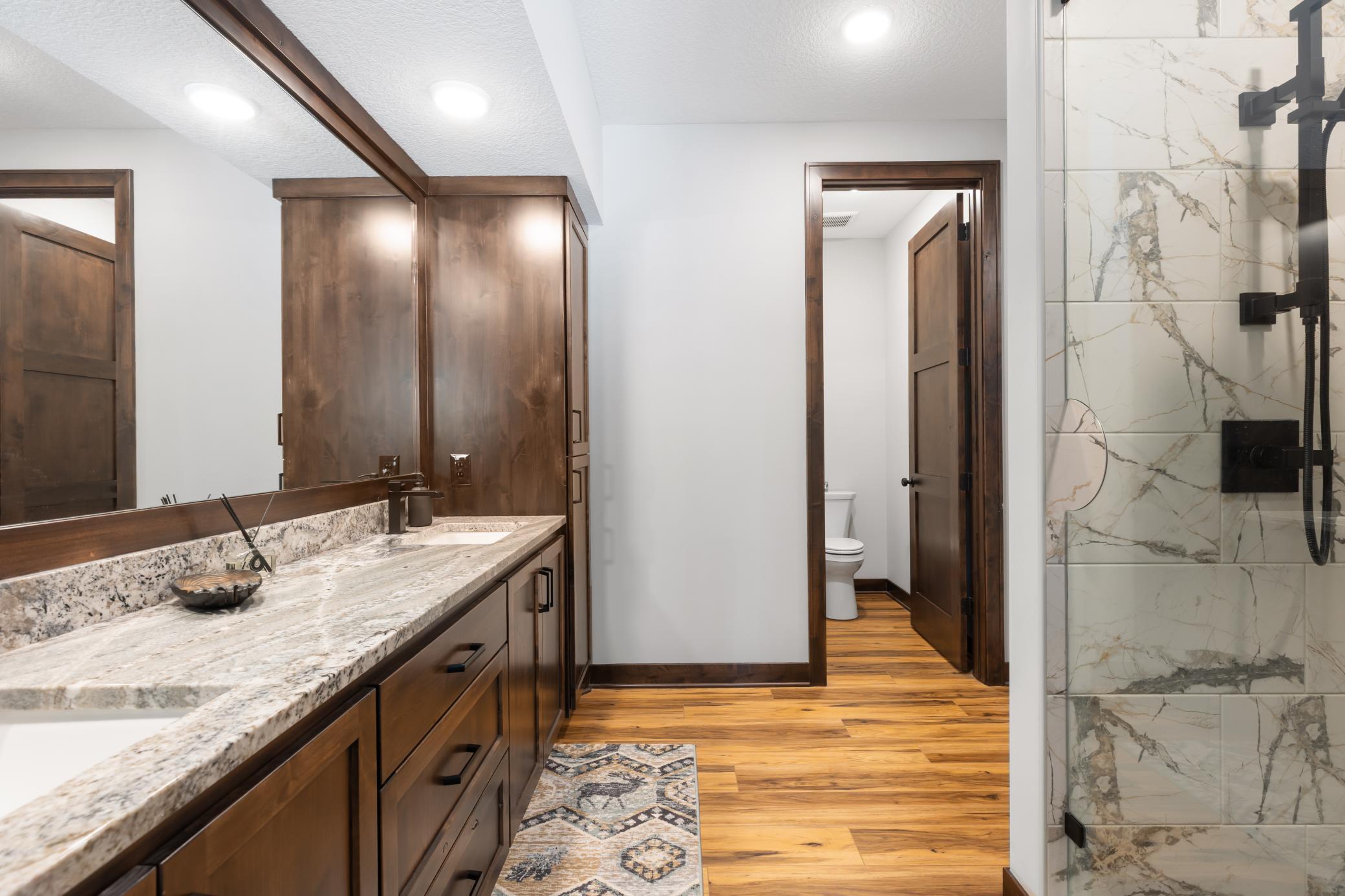 Thoughtful design is evident throughout the home, right down to the shower, where a discreet opening in the glass allows you to turn on the water before stepping in.