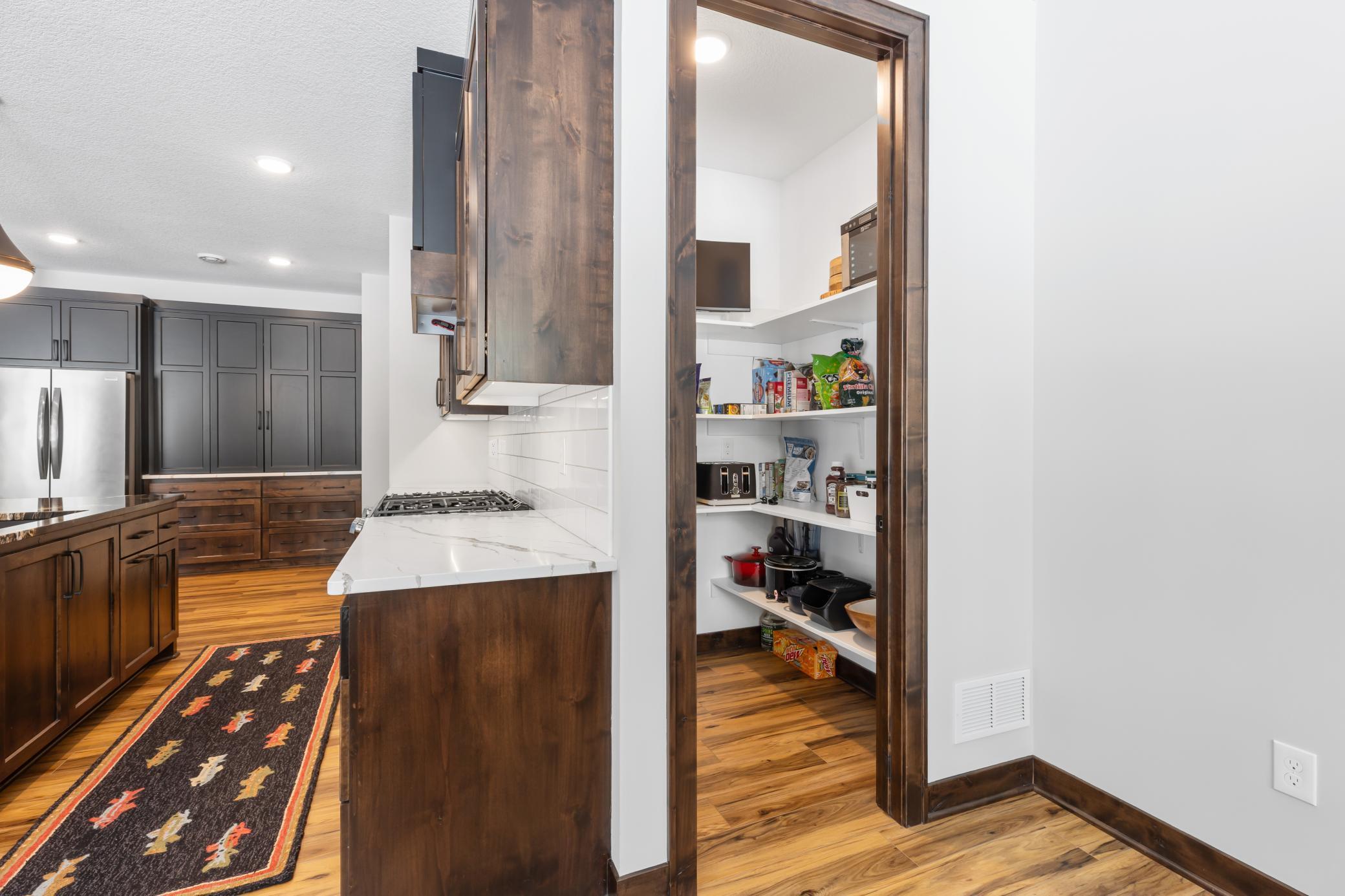 Quietly tucked around the corner between the kitchen and dining room, you will find this fabulous walk-in pantry providing ample storage for boat snacks.