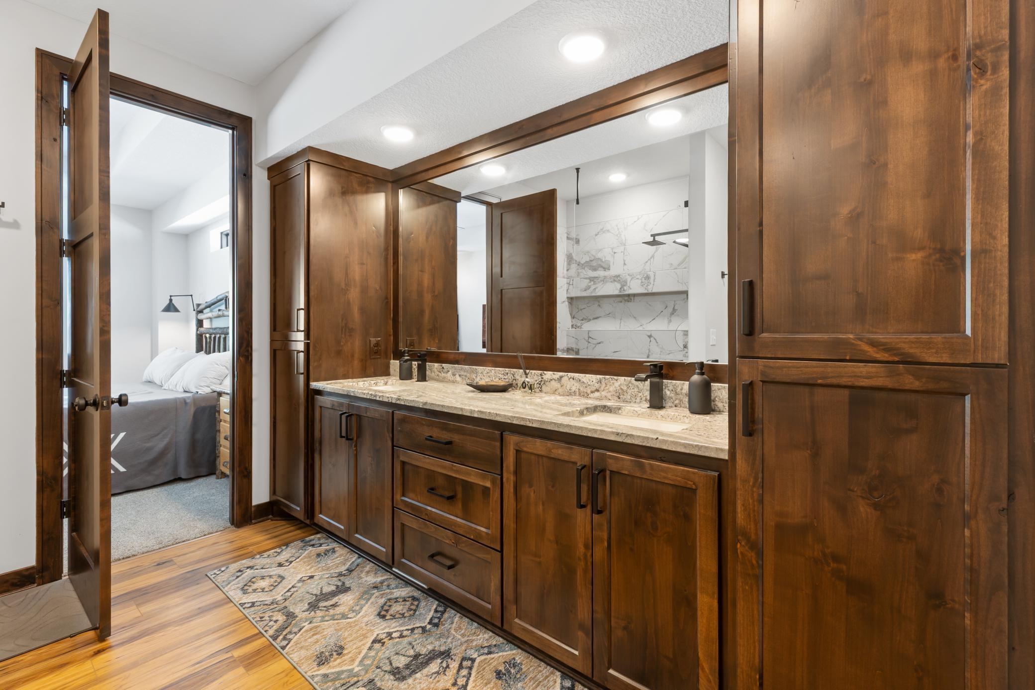 The primary suite opens to a spa-inspired bath, complete with a double vanity and walk-in shower.