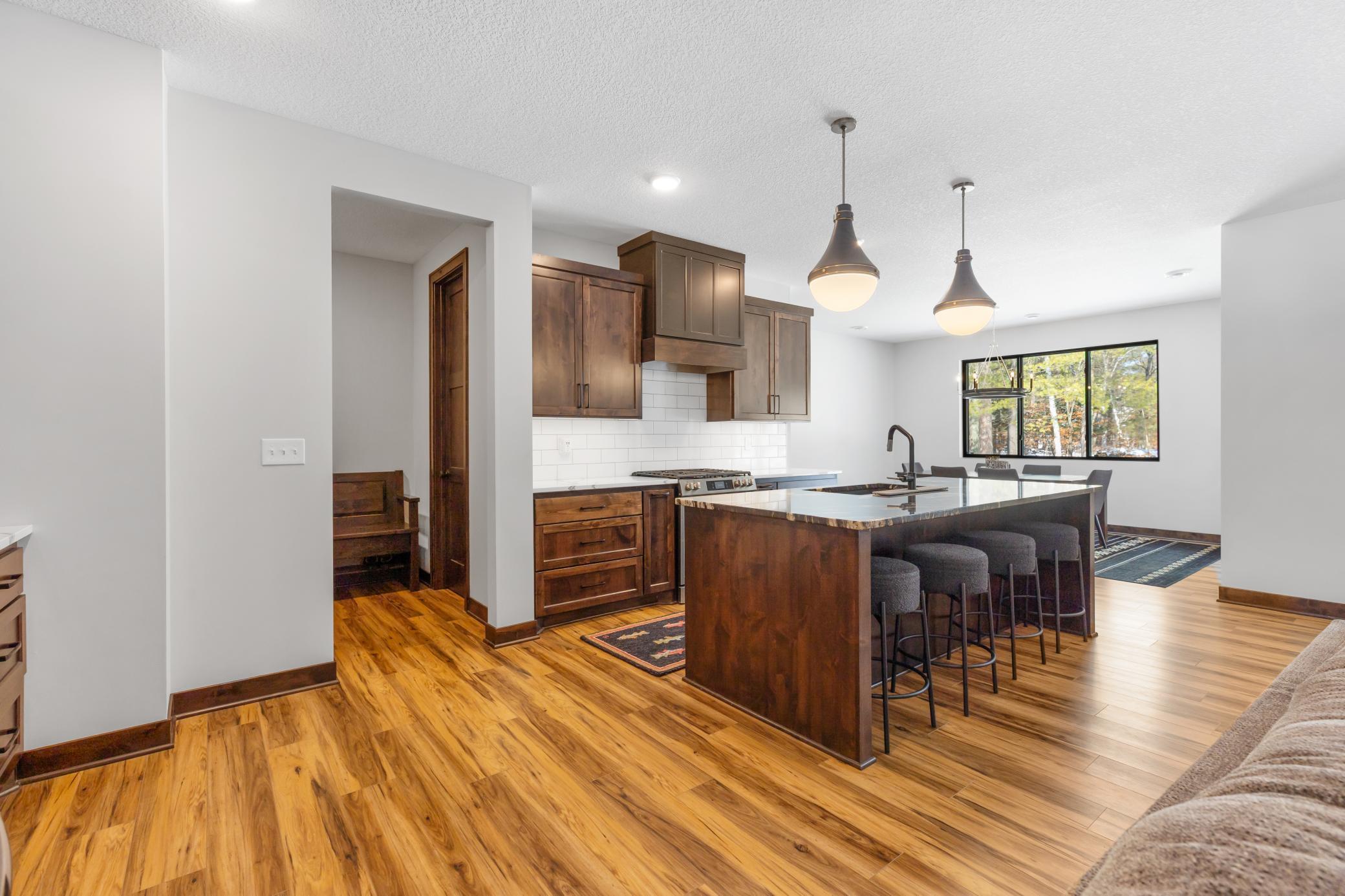 Through the kitchen, you will find convenient access to the attached garage. Prepping groceries for a weekend at the lake has never been easier.