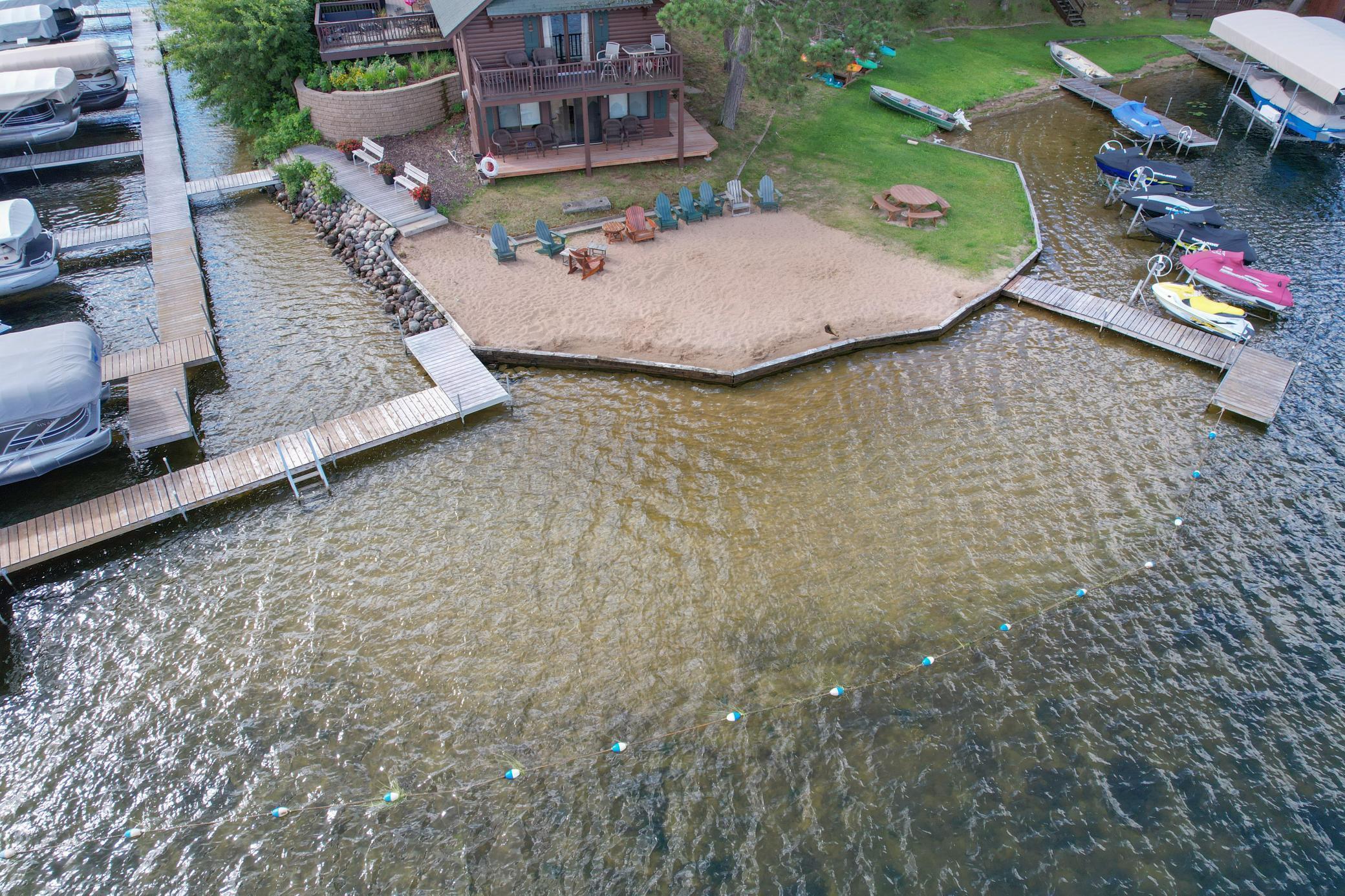 A protected swimming area, set apart from boat traffic, offers a safe and comfortable experience with a natural sandy bottom.