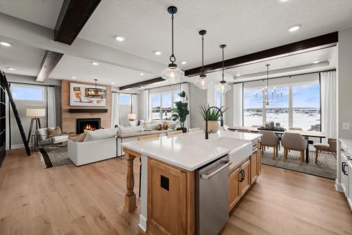 Hosts view of the kitchen, great room and dinning room. (model photo)