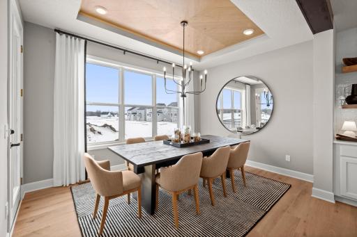 With the dinning room being connected to the kitchen it will be a space you will use, and all the large windows make it fantastic space to enjoy even outside of meal time. (model photo)