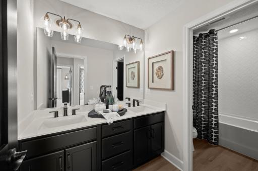 The upper level main bath is stunning and spacious! It is perfect for servicing the upper level bedrooms. (model photo)