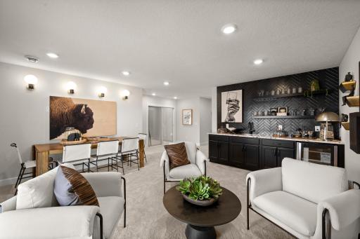 If you are typically the host for holiday get togethers? You can continue that tradition as this home features this huge lower level rec room. (model photo)