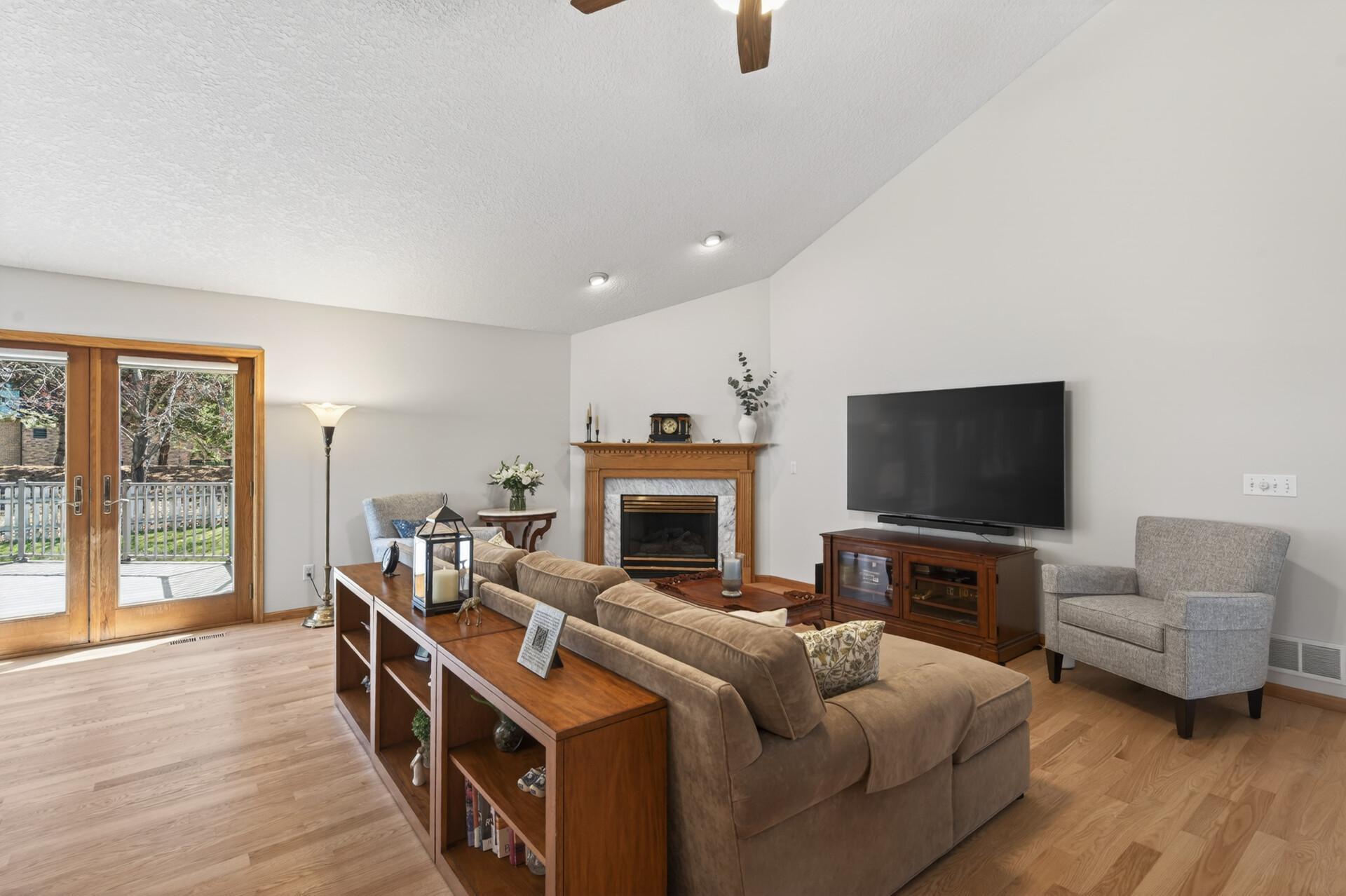 Great room with a French door that opens to the deck & outdoor spaces