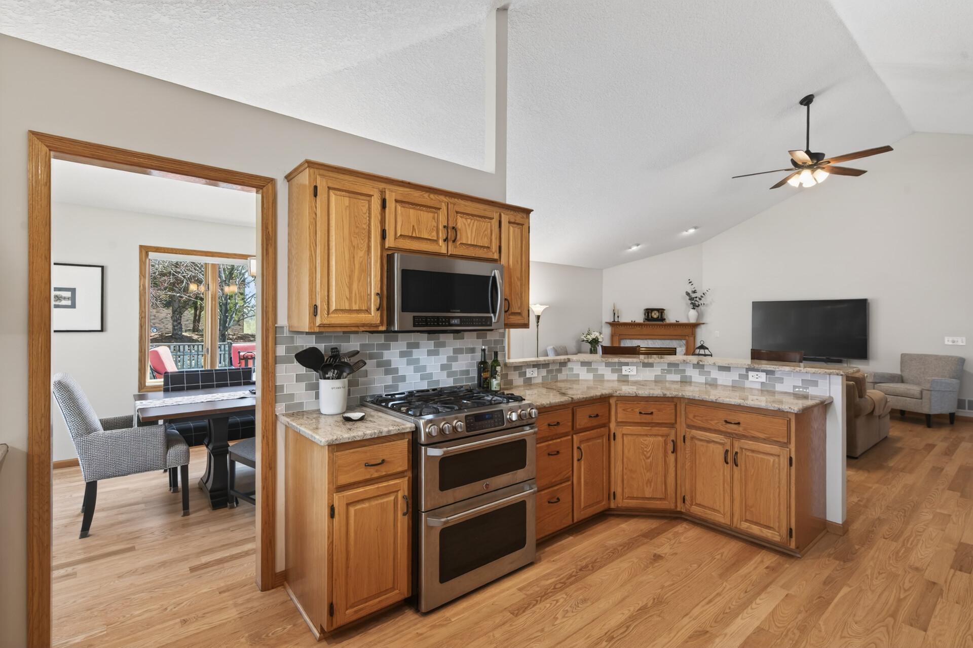 Kitchen has stainless appliances (gas range has 5 burners and dual oven)