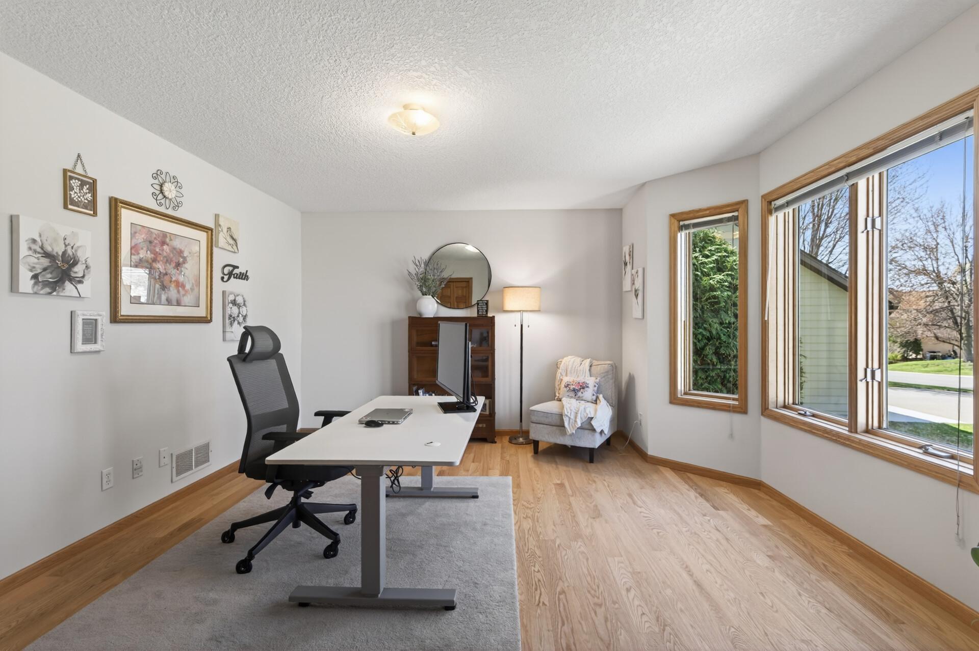 Main floor bedroom 2 is currently used as an office. Bay window brings in lots of natural light.
