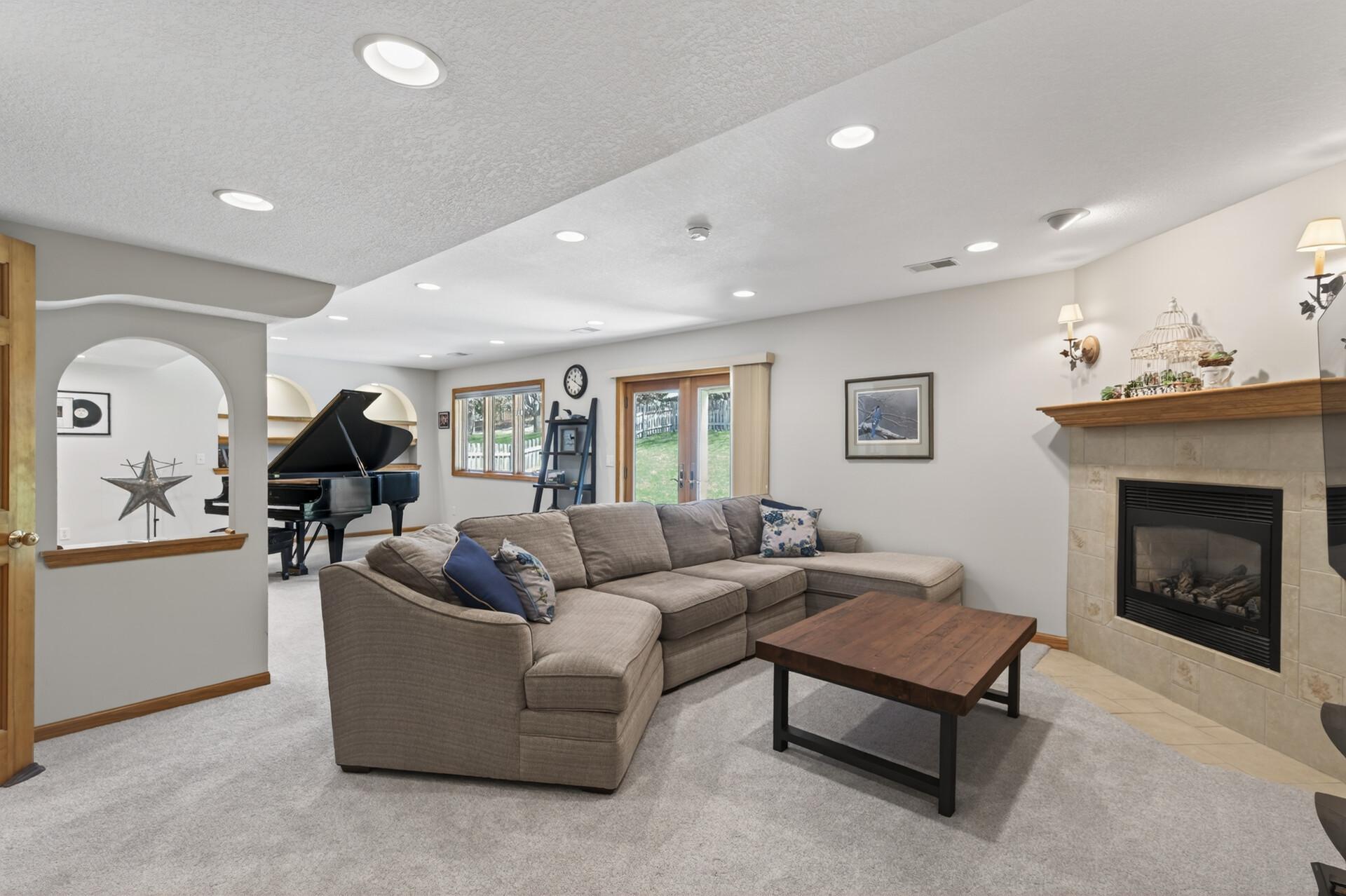 Lower level walkout! Family room with a gas burning fireplace