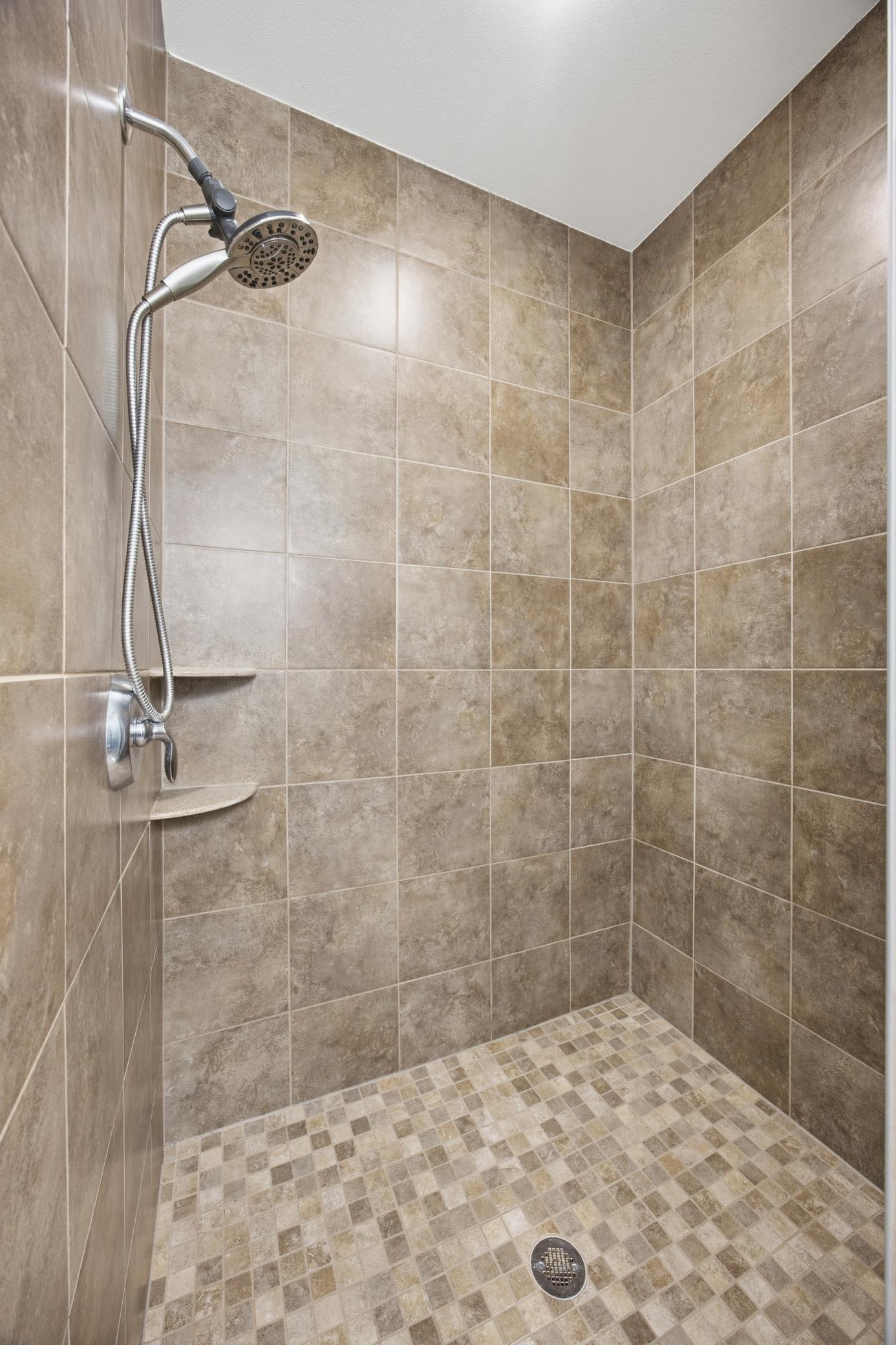 Tile shower in primary bathroom