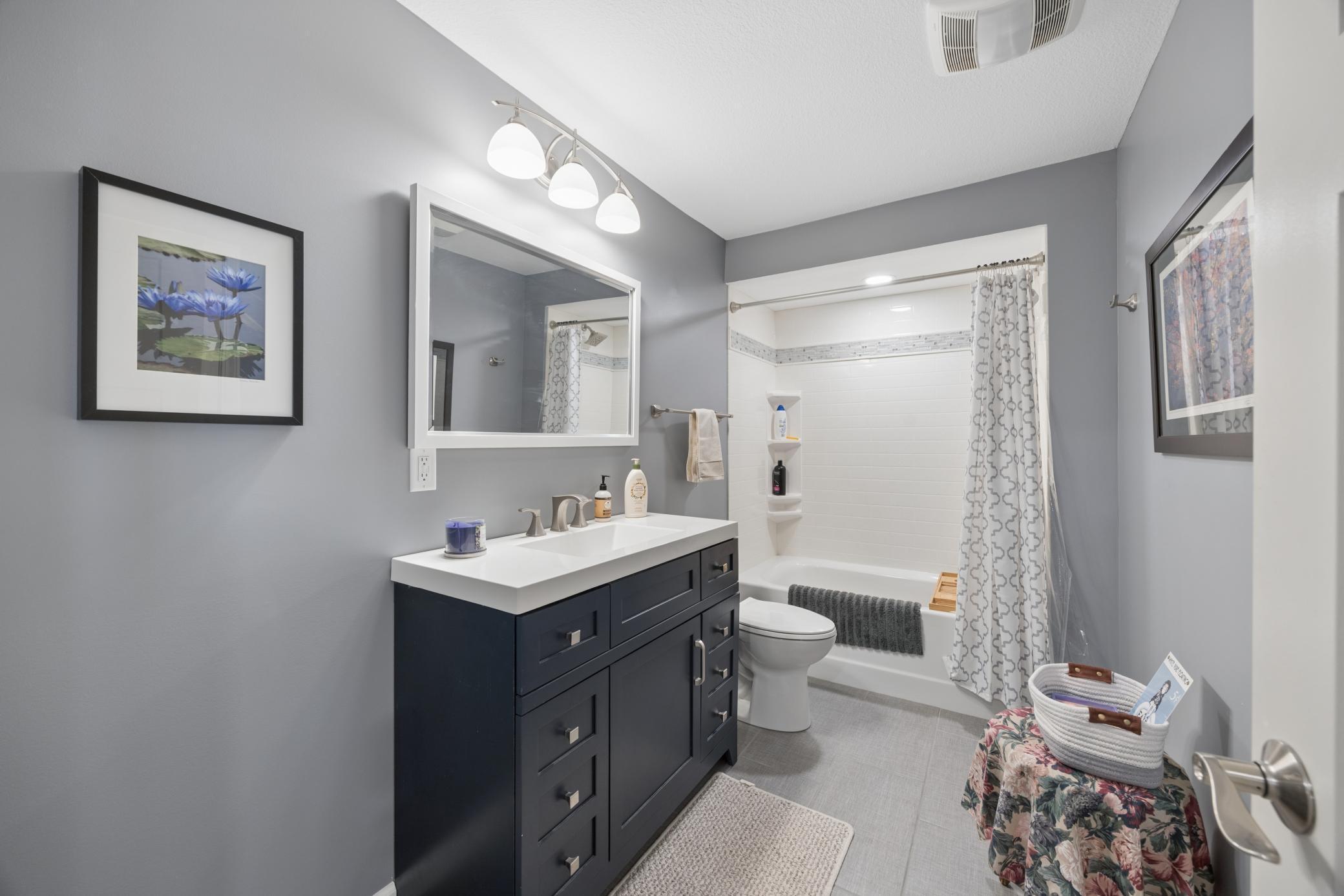 Full lower level bath with heated floor and deep tub