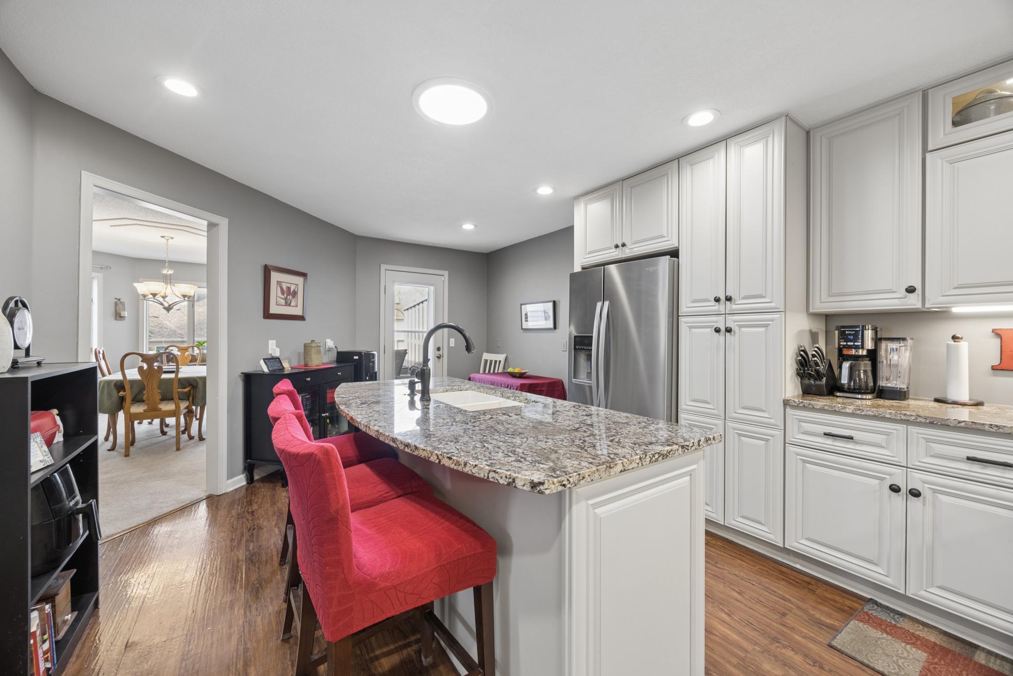 Doorway on the left leads to the dining room, and the one on the right leads to the deck