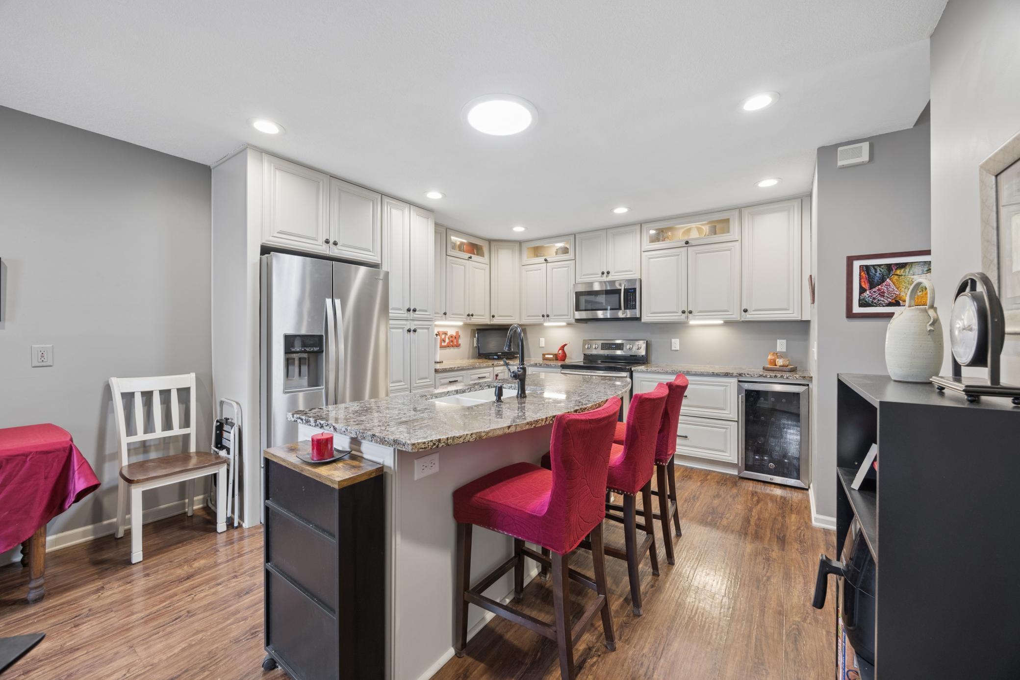 Bright kichen with stainless appliances
