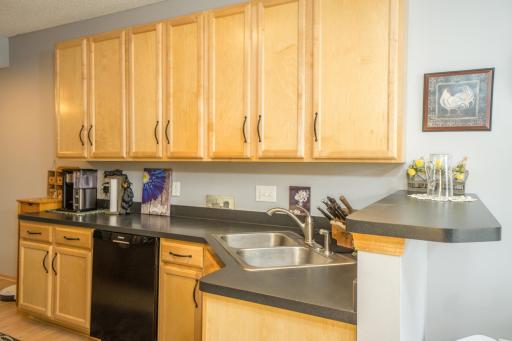 Gorgeous kitchen with taller upper maple cabinets.