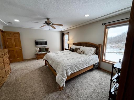 Spacious primary suite designed for comfort and relaxation. Electric fireplace stays.