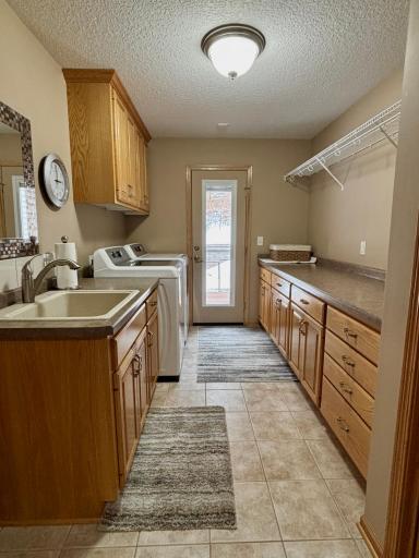 Main floor laundry with door access to deck.
