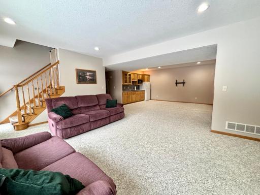 Finished walkout basement with wet bar and flexible living space.