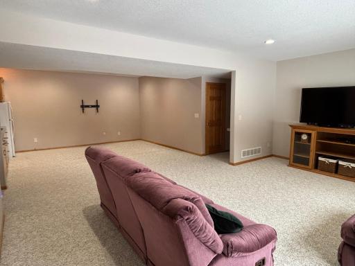 Finished walkout basement with wet bar and flexible living space.