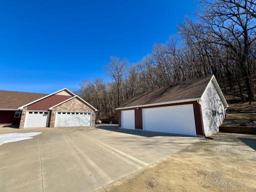 Spacious driveway with 3-car detached garage.