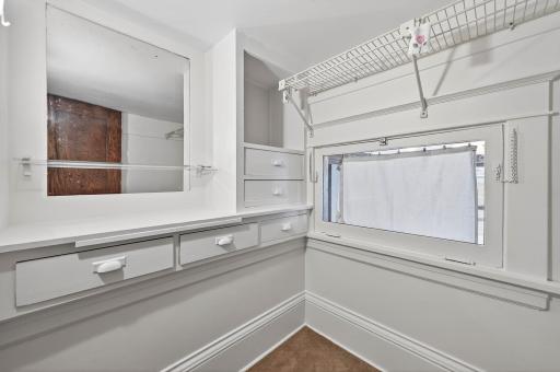 Step-up walk-in closet with lovely built-ins