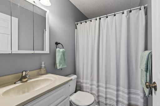 Full upper-level bathroom featuring fresh paint, a vanity, shower/tub combination, and a clean, functional layout.