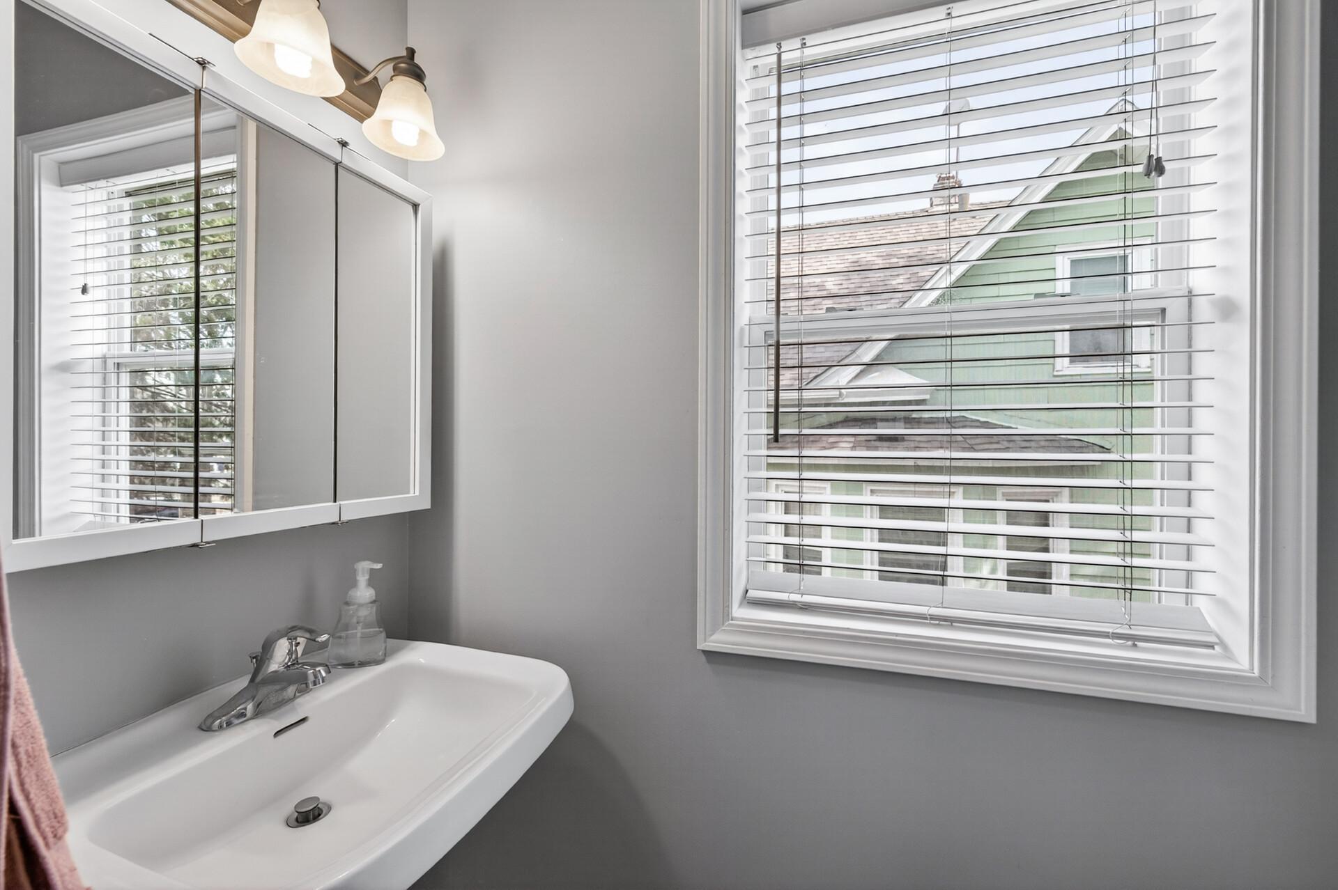 Main-level 1/2 powder bathroom—perfect for guests and everyday convenience, featuring fresh paint throughout.