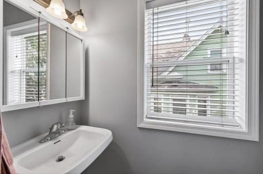 Main-level 1/2 powder bathroom—perfect for guests and everyday convenience, featuring fresh paint throughout.