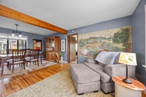 Main floor family room to DR; door leads to primary bedroom