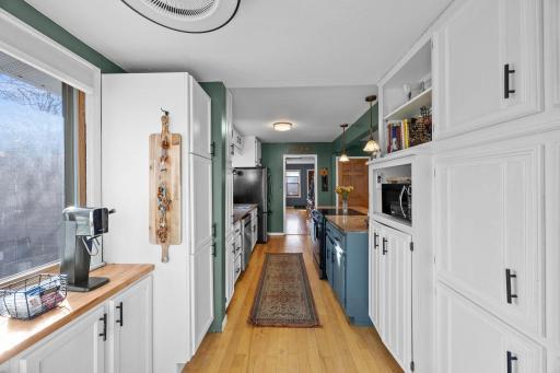 Pantry to kitchen to DR to LR view