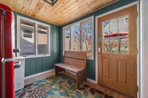Porch/mud room to fenced yard