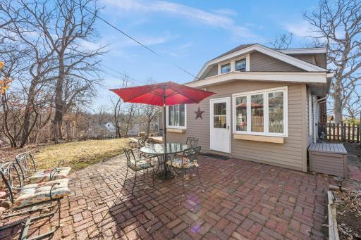 Paver brick patio inside fenced yard