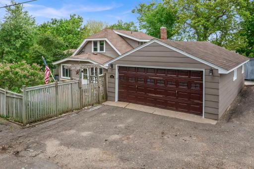 Detached, oversized 20 x 30 ft garage with refreshed exterior paint, workshop, and 220v outlet.