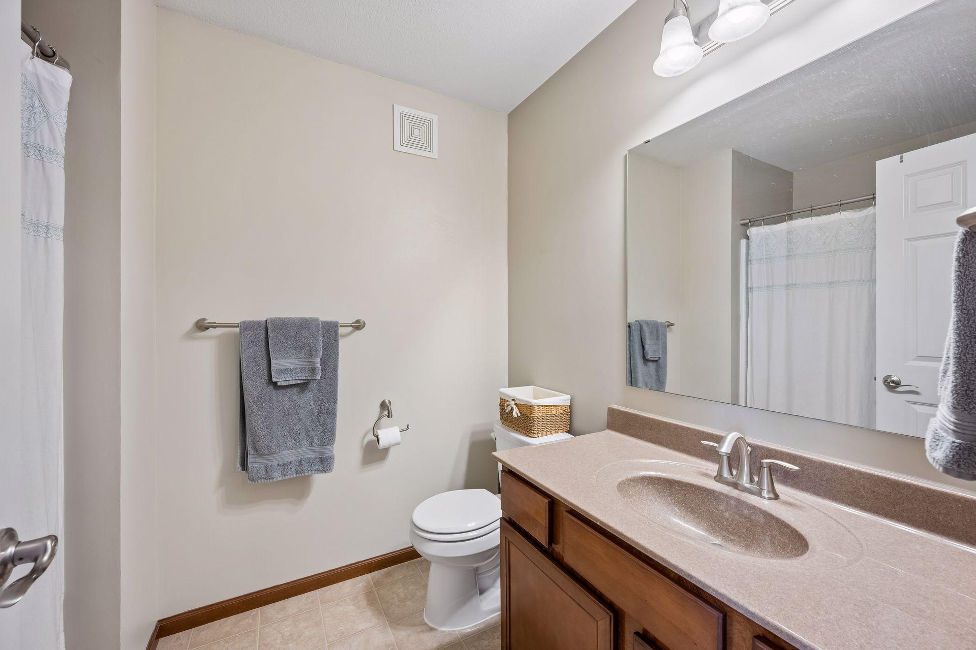 Upper level full bath serves the 2nd bedroom.