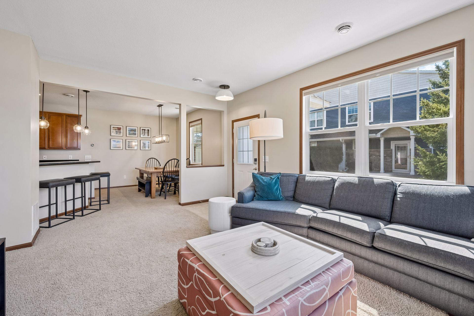Another view of the living room, foyer, dining area and breakfast bar. Southern sun is filling this room!