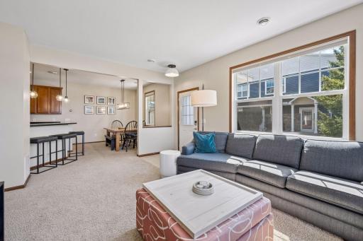 Another view of the living room, foyer, dining area and breakfast bar. Southern sun is filling this room!