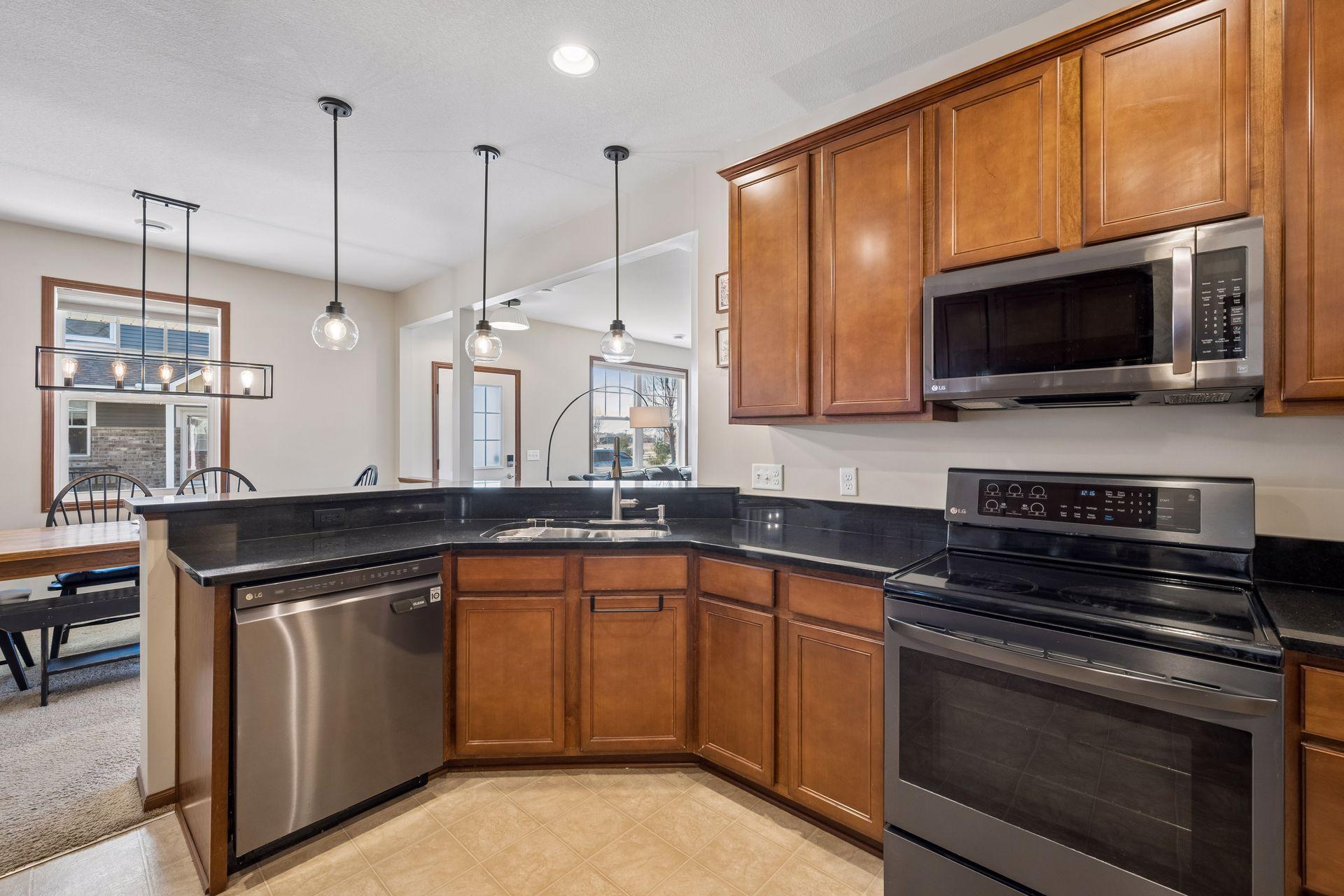 The kitchen has so much counter space offering room for multiple food prep tasks. Updated light fixtures.