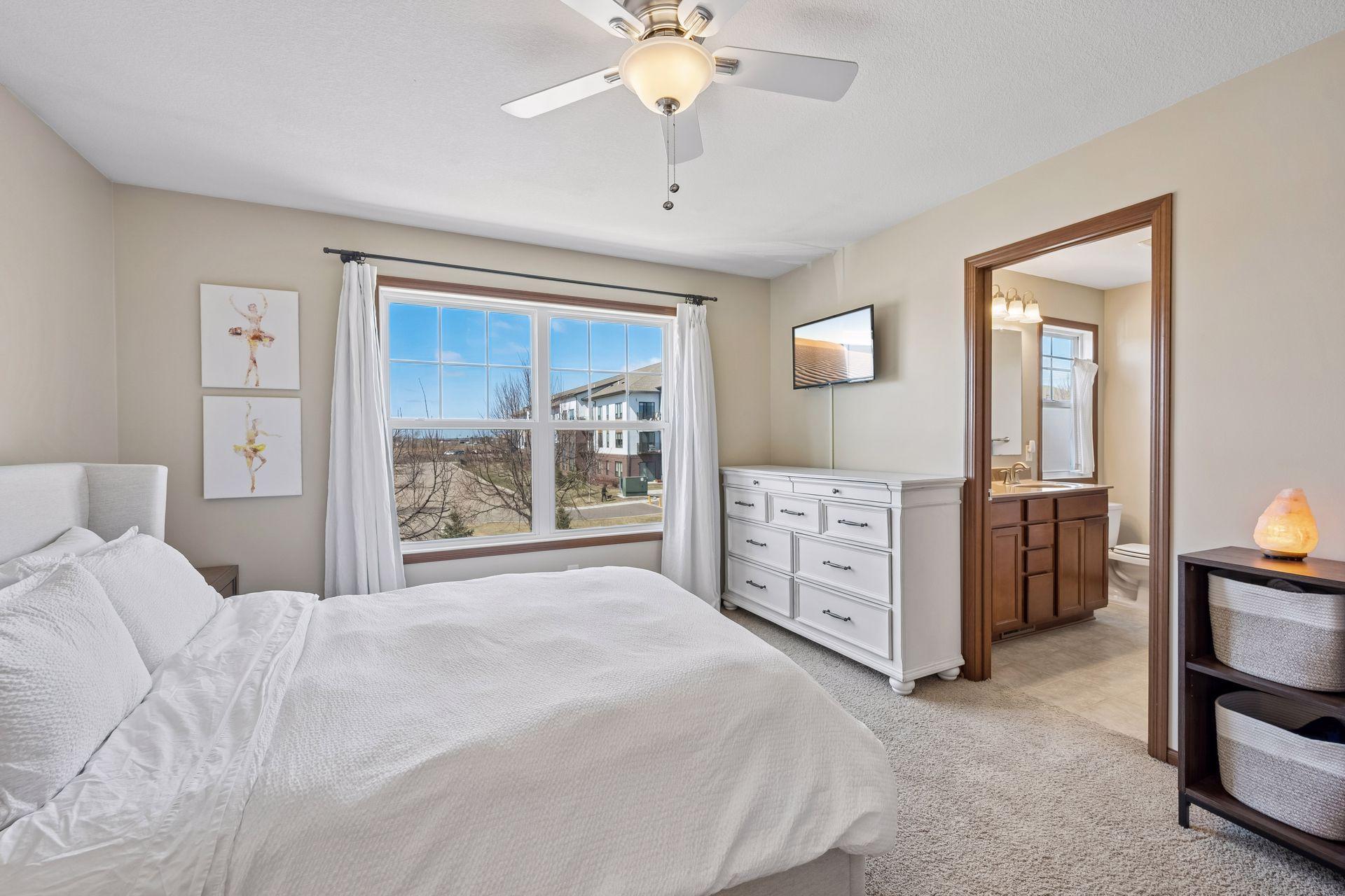 Another view of the primary bedroom and bath.